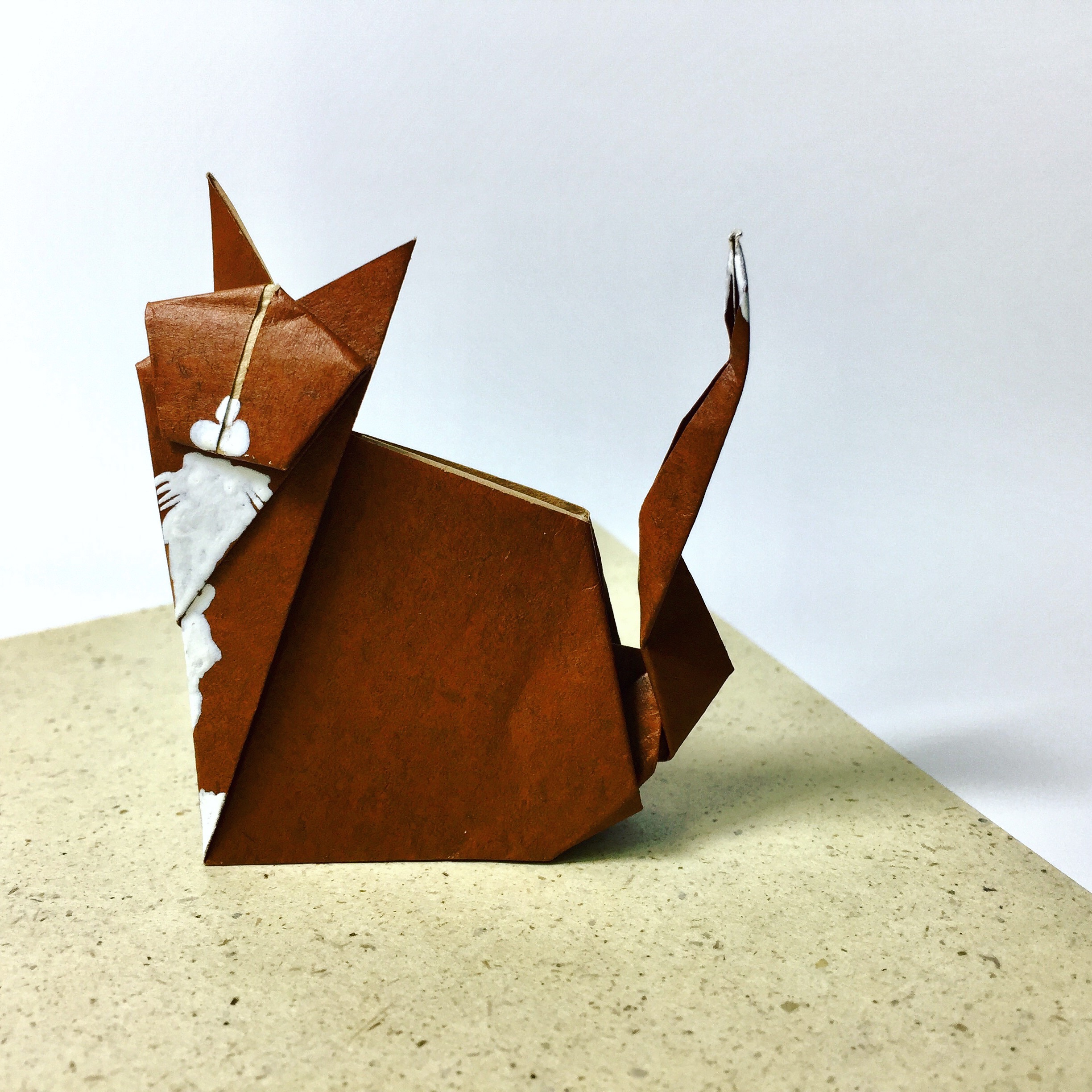 brown origami sitting cat