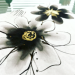 abstract sumi ink flowers with gold details in the center