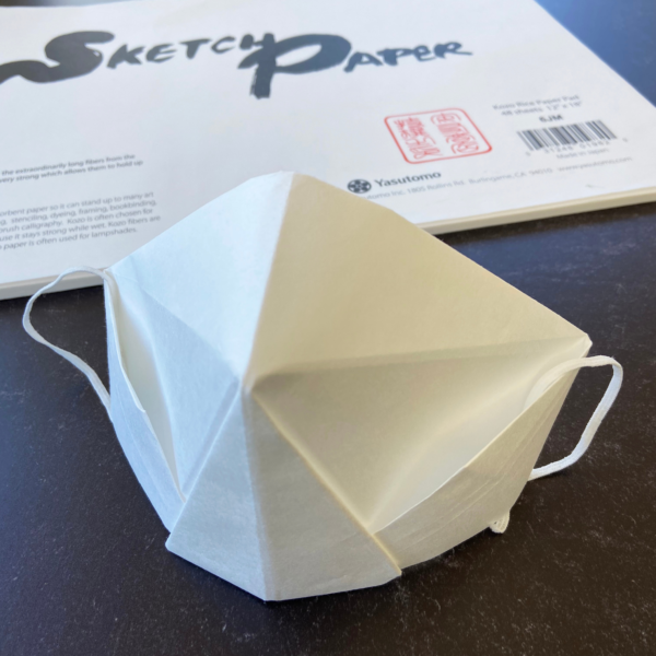 Close up view of origami mask made of 6JM