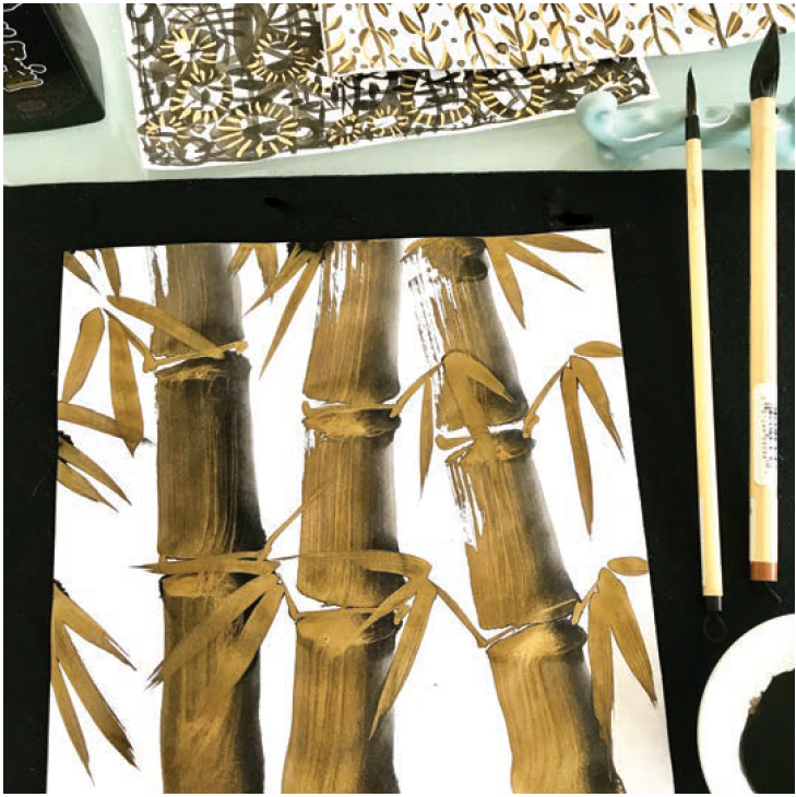 sumi-e bamboo stalks painted with golden black sumi ink