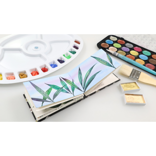 Folded watercolor journal painted with Niji Best Waterbrush