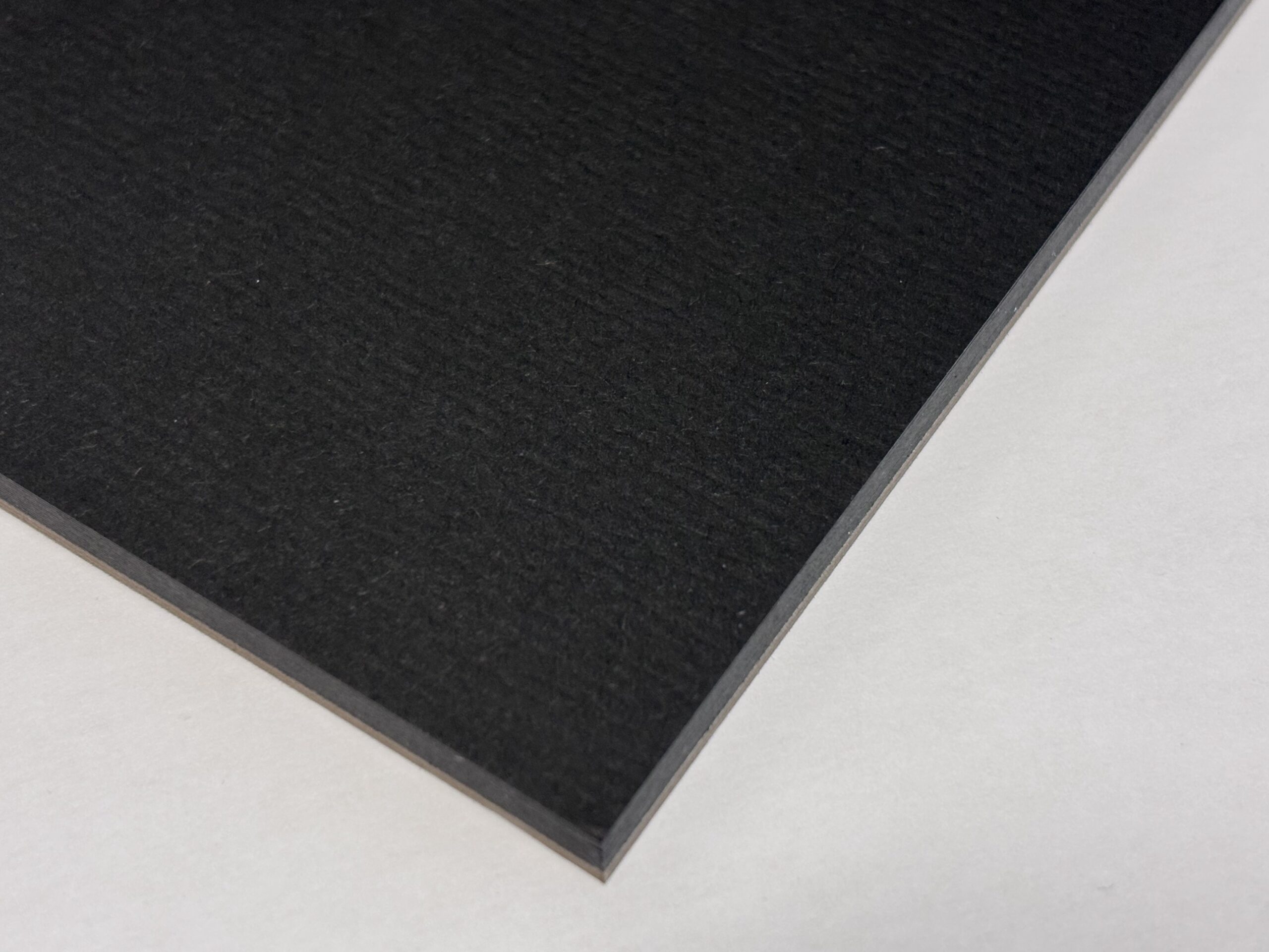 close up image of the corner of an open black watercolor paper pad