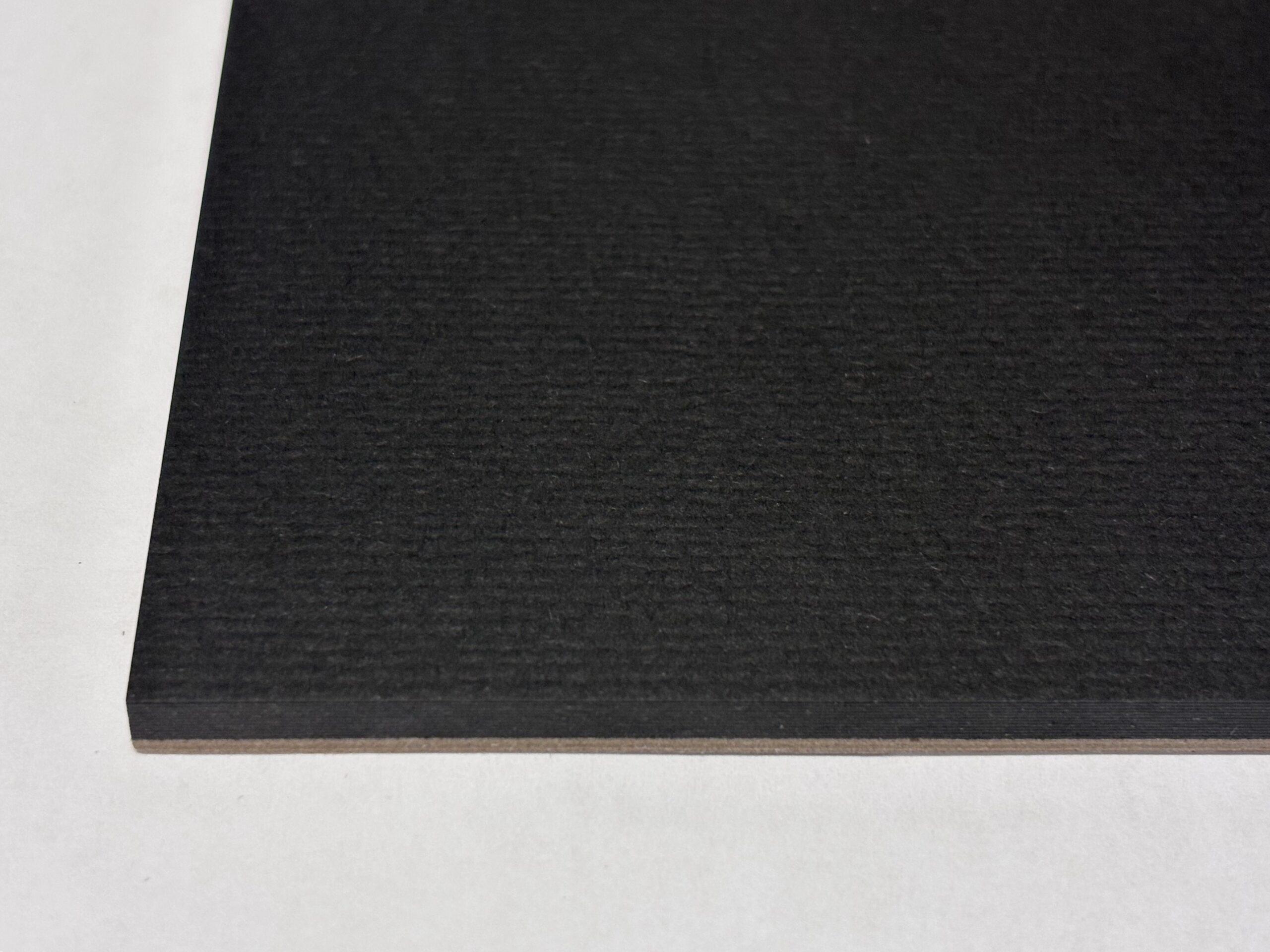 close up picture of black watercolor paper showing the surface texture