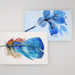 blue flower watercolor painting and blue feather watercolor painting side by side