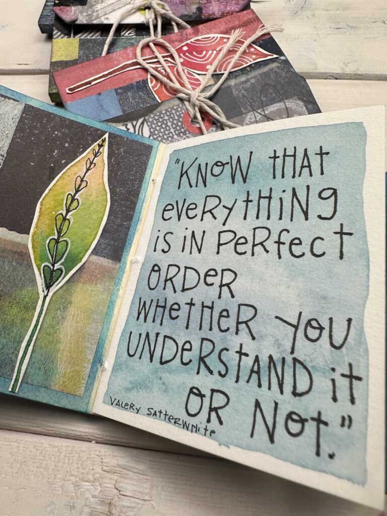 tag book with a collaged leaf page and the right page reading the quote "Know that everything is in perfect order whether you understand it or not."