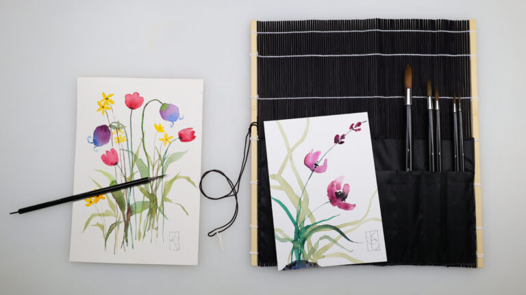 fudemaki with five Fusion brushes in the pockets and an abstract florals watercolor paintings to the side
