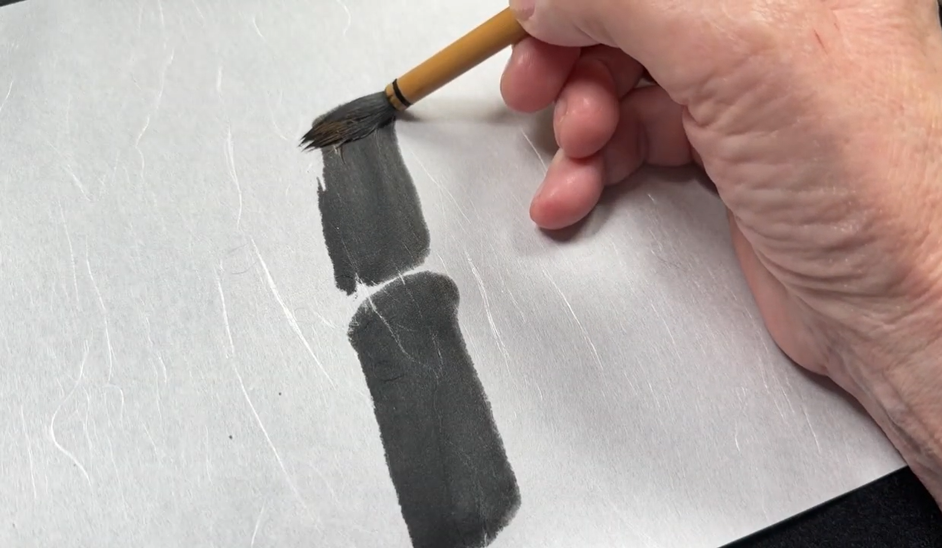 sumi-e bamboo talk being painted on unryu paper