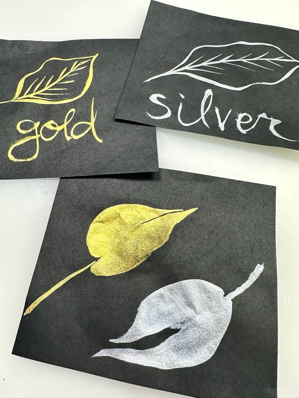 gold and silver leaves painted on black washi paper