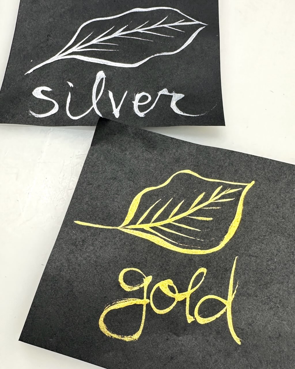 gold and silver leaves painted on black washi paper