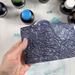 momigami made with black washi paper and painted with metallic violet ink