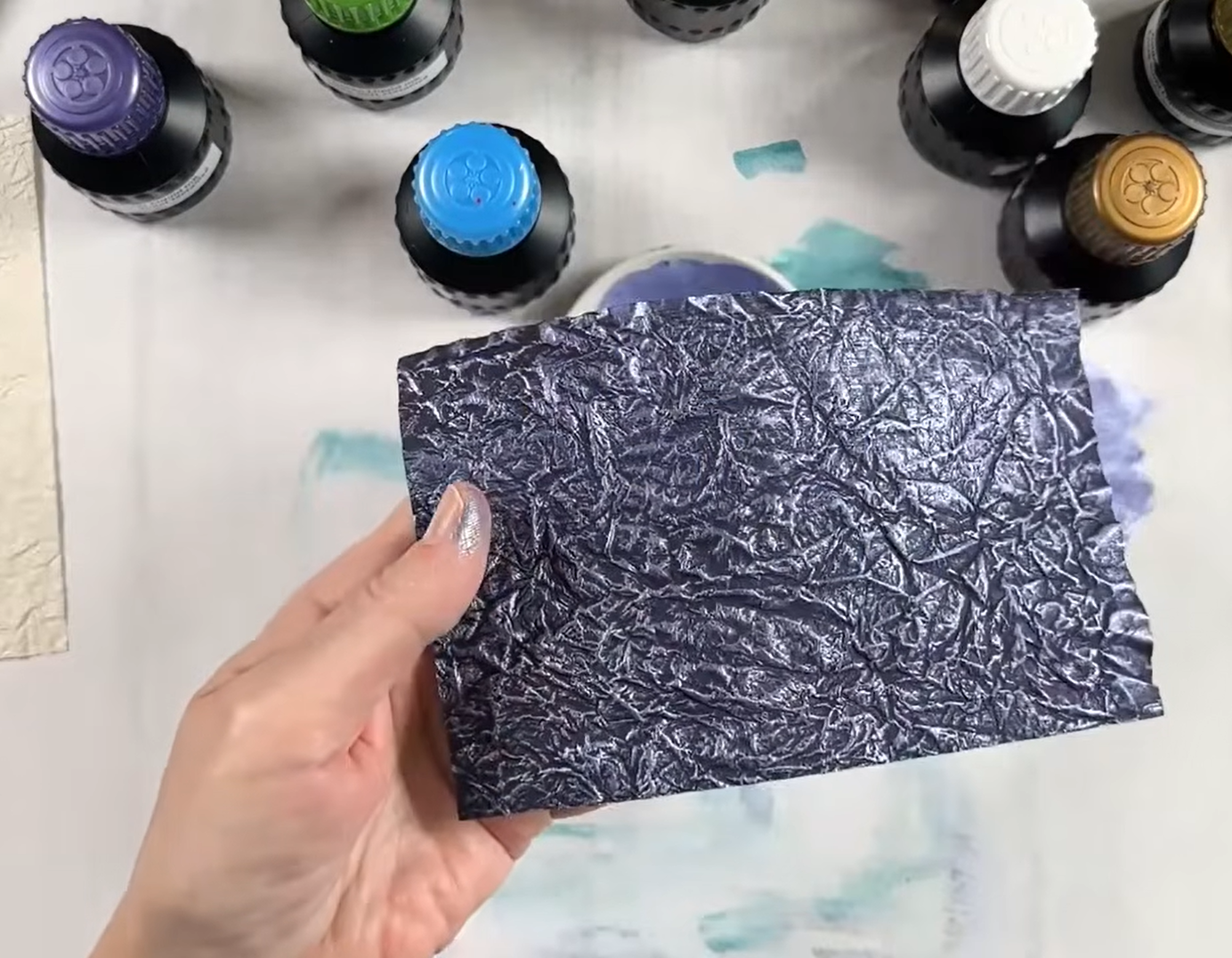 momigami made with black washi paper and painted with metallic violet ink