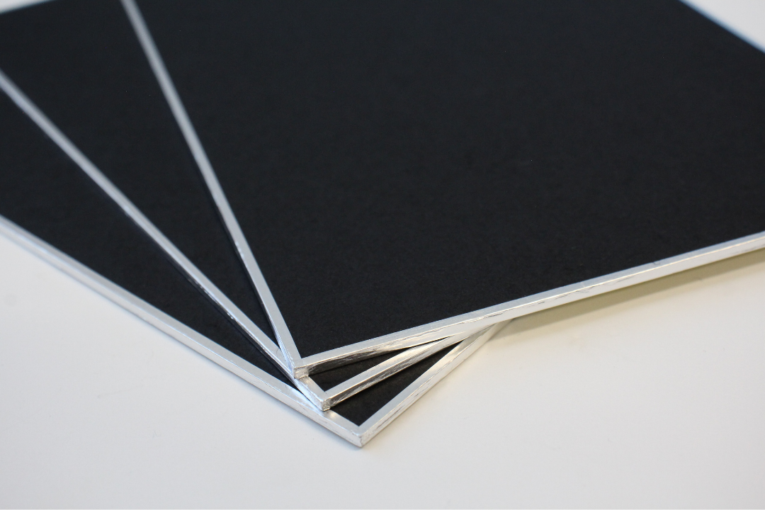 close up shot of three black shikishi board corners