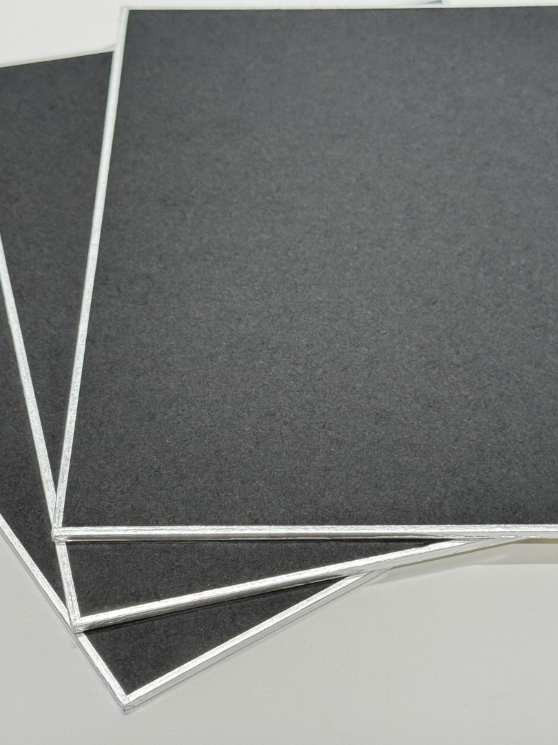 close up shot of three black shikishi board corners