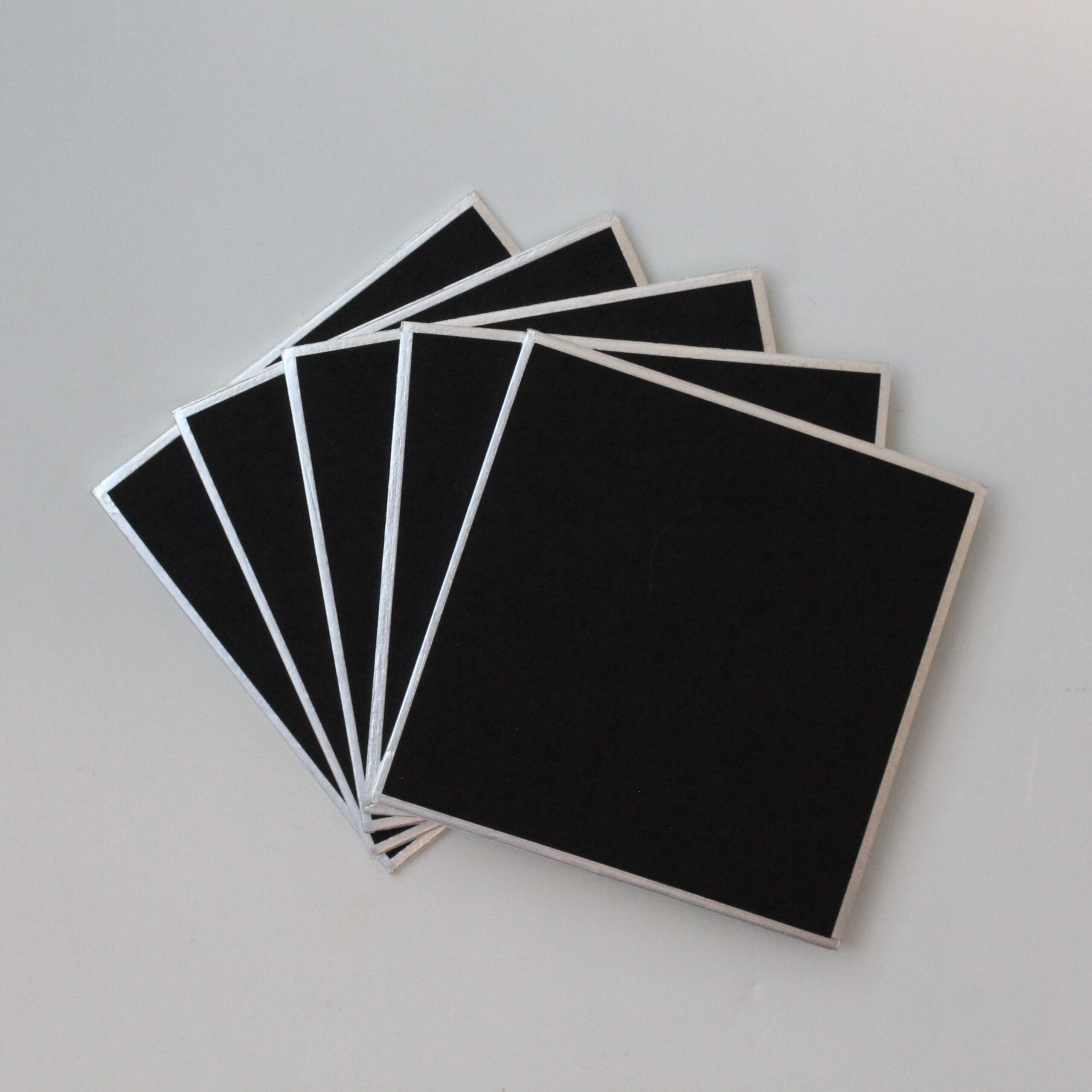 five black shikishi boards fanned out