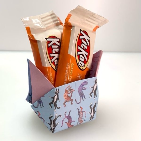 origami cat box made with dancing cats origami and filled with candy
