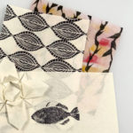 stack of Mashi paper artwork, including fish print, origami, monoprinting and encaustic pieces